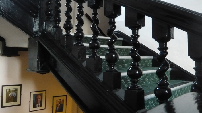 The seventeenth-century staircase of the main building of St Cuthbert's Society.